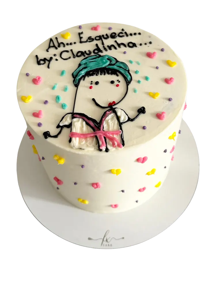 Bolo branco com boneca desenhada à mão e corações coloridos